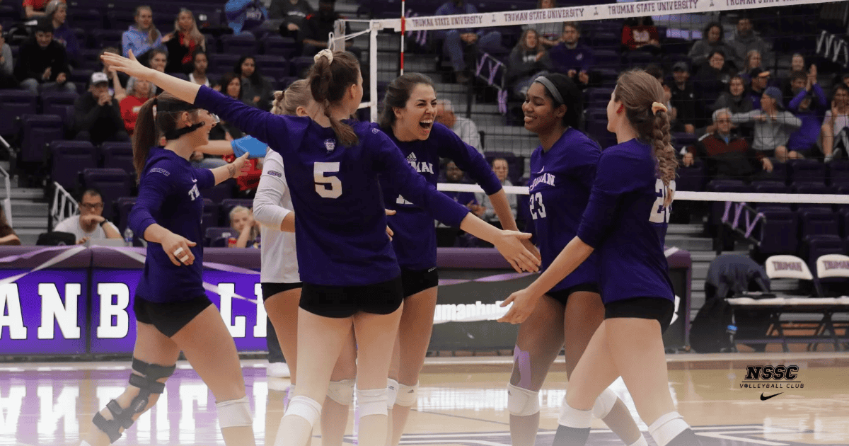 Volleyball team celebrating a victory.