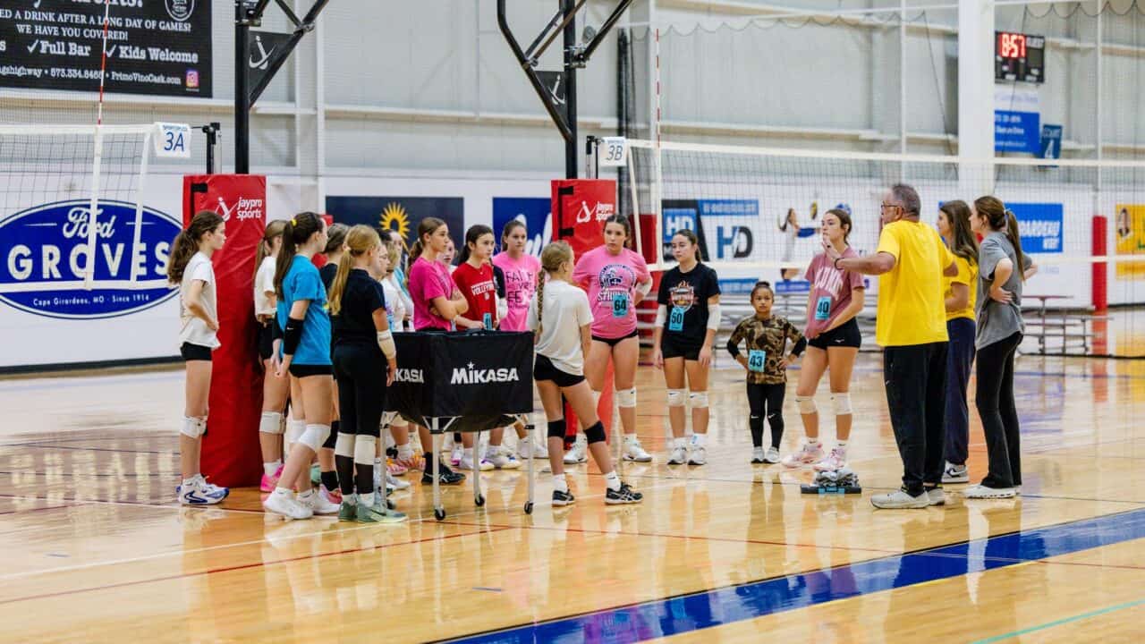 Coaches huddle with athletes at NSSC youth volleyball tryouts in Cape Girardeau