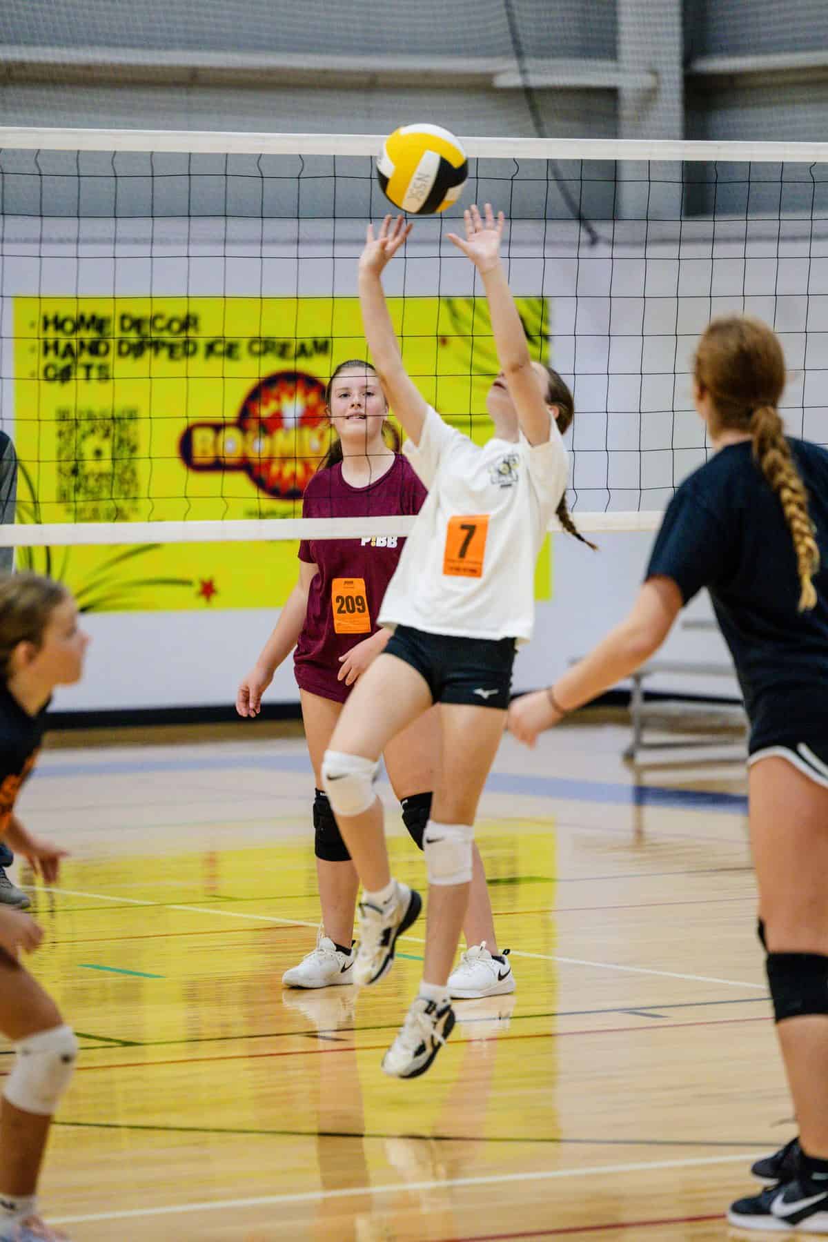 A 13U/14U athlete sets the ball during NSSC tryouts