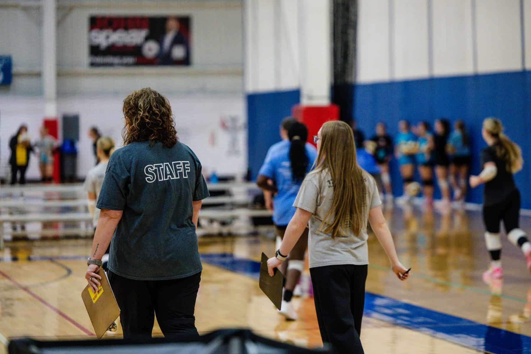 NSSC staff take notes as athletes rotate through tryout drills