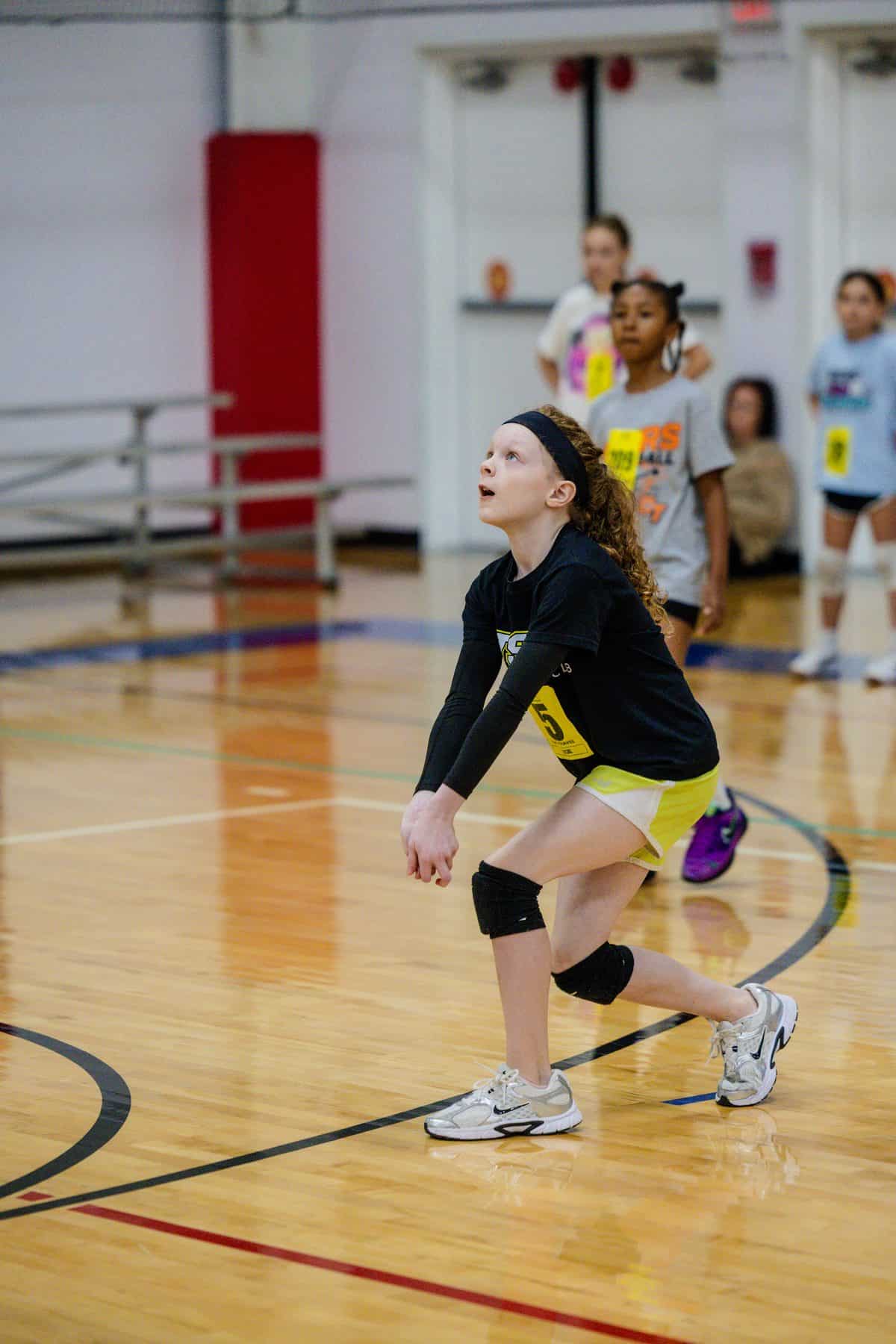 A young athlete passes at NSSC 10U–12U youth volleyball tryouts