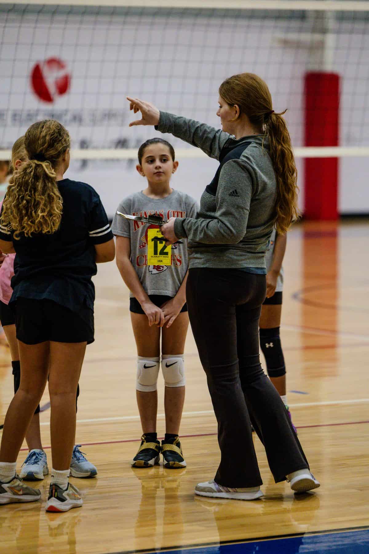 An NSSC coach directs athletes during the 10U–12U tryout session
